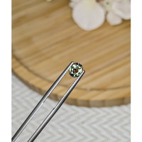 0.88 Ct. Yellowish Green Sapphire from Madagascar Life Style