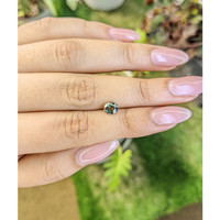 0.88 Ct. Yellowish Green Sapphire from Madagascar Life Style