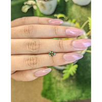 0.70 Ct. Yellowish Green Sapphire from Madagascar Life Style