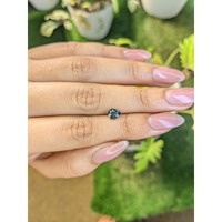 0.75 Ct. Bluish Green Sapphire from Madagascar Life Style