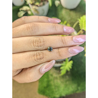 0.97 Ct. Yellowish Green Sapphire from Madagascar Life Style