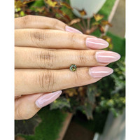 0.62 Ct. Yellowish Green Sapphire from Madagascar Life Style