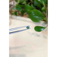 0.66 Ct. Bluish Green Sapphire from Madagascar Life Style