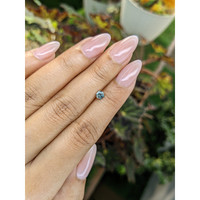 0.40 Ct. Bluish Green Sapphire from Madagascar Life Style