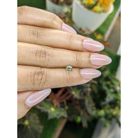 0.50 Ct. Yellowish Green Sapphire from Madagascar Life Style