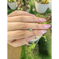 0.71 Ct. Yellowish Green Sapphire from Madagascar Life Style