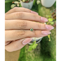 0.57 Ct. Yellowish Green Sapphire from Madagascar Life Style