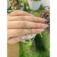 0.75 Ct. Yellowish Green Sapphire from Madagascar Life Style