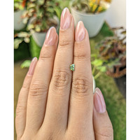 0.36 Ct. Yellowish Green Sapphire from Madagascar Life Style