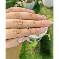 0.36 Ct. Yellowish Green Sapphire from Madagascar Life Style