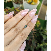 0.48 Ct. Yellowish Green Sapphire from Madagascar Life Style