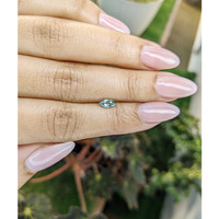 0.48 Ct. Yellowish Green Sapphire from Madagascar Life Style