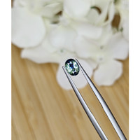 0.71 Ct. Bluish Green Sapphire from Madagascar Life Style