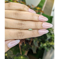 0.48 Ct. Yellowish Green Sapphire from Madagascar Life Style