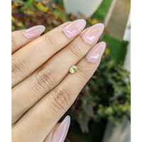 0.67 Ct. Greenish Yellow Sapphire from Madagascar Life Style