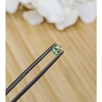 0.54 Ct. Greenish Yellow Sapphire from Madagascar Life Style