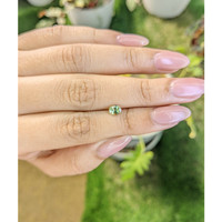 0.54 Ct. Greenish Yellow Sapphire from Madagascar Life Style