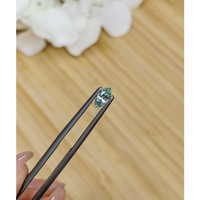 0.46 Ct. Bluish Green Sapphire from Madagascar Life Style