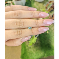 0.46 Ct. Bluish Green Sapphire from Madagascar Life Style