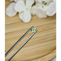 0.77 Ct. Greenish Yellow Sapphire from Madagascar Life Style