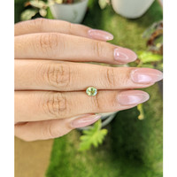 0.77 Ct. Greenish Yellow Sapphire from Madagascar Life Style