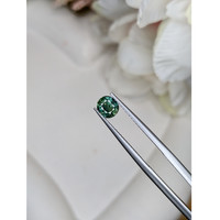 0.93 Ct. Bluish Green Sapphire from Madagascar Life Style