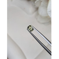 0.68 Ct. Brownish Green Sapphire from Ceylon (Sri Lanka) Life Style