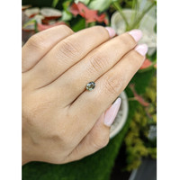 0.68 Ct. Brownish Green Sapphire from Ceylon (Sri Lanka) Life Style