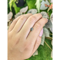 0.70 Ct. Brownish Green Sapphire from Madagascar Life Style
