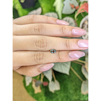 0.70 Ct. Brownish Green Sapphire from Madagascar Life Style
