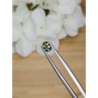 0.79 Ct. Yellowish Green Sapphire from Madagascar Life Style