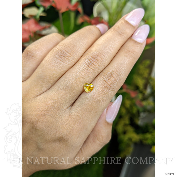 0.74 Ct. Orangish Yellow Sapphire from Ceylon (Sri Lanka)