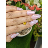 0.74 Ct. Orangish Yellow Sapphire from Ceylon (Sri Lanka) Life Style
