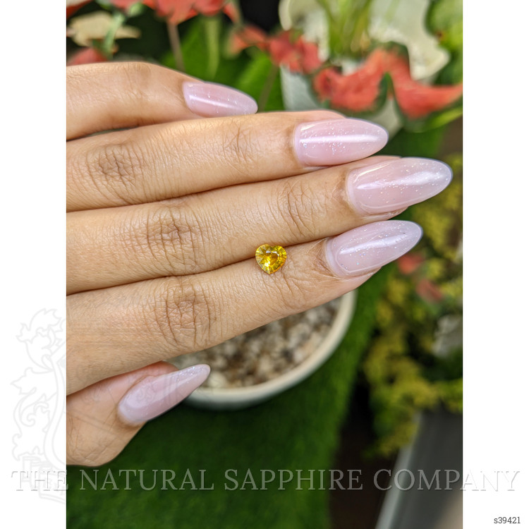 0.74 Ct. Orangish Yellow Sapphire from Ceylon (Sri Lanka)