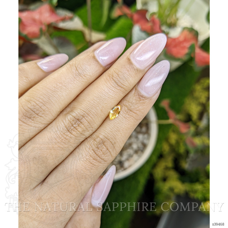 0.44 Ct. Orangish Yellow Sapphire from Ceylon (Sri Lanka)