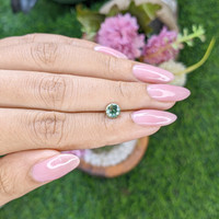 0.91 Ct. Bluish Green Sapphire from Madagascar Life Style