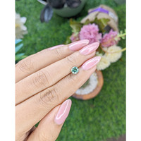 0.85 Ct. Bluish Green Sapphire from Madagascar Life Style