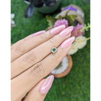0.92 Ct. Yellowish Green Sapphire from Madagascar Life Style