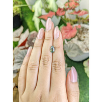 1.56 Ct. Bluish Green Sapphire from Madagascar Life Style