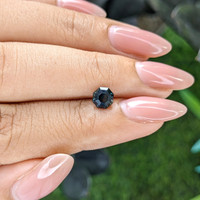 0.98 Ct. Bluish Green Sapphire from Madagascar Life Style