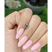 0.89 Ct. Bluish Green Sapphire from Madagascar Life Style