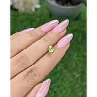 0.83 Ct. Yellowish Green Sapphire from Madagascar Life Style