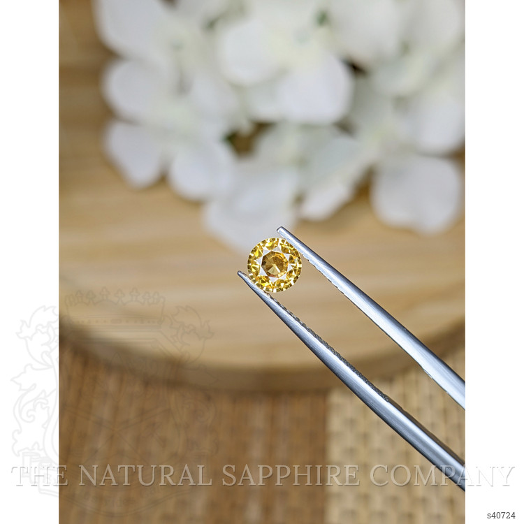 0.70 Ct. Orangish Yellow Sapphire from Ceylon (Sri Lanka)
