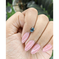 0.71 Ct. Greenish Blue Sapphire from Madagascar Life Style