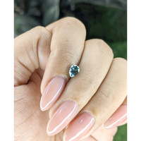 0.69 Ct. Bluish Green Sapphire from Madagascar Life Style