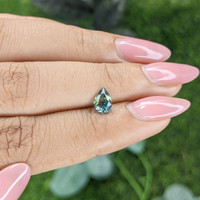0.74 Ct. Bluish Green Sapphire from Madagascar Life Style