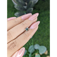 0.74 Ct. Bluish Green Sapphire from Madagascar Life Style