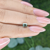 0.74 Ct. Bluish Green Sapphire from Madagascar Life Style