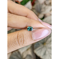 0.83 Ct. Bluish Green Sapphire from Madagascar Life Style