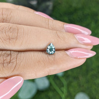 0.71 Ct. Bluish Green Sapphire from Madagascar Life Style